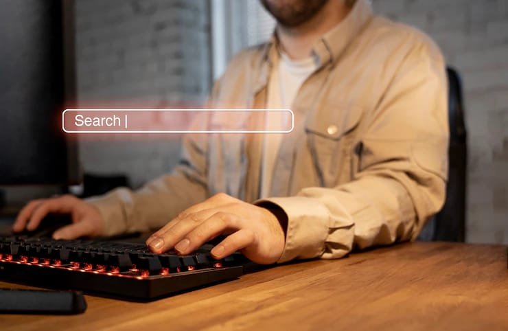 person is seraching in laptop